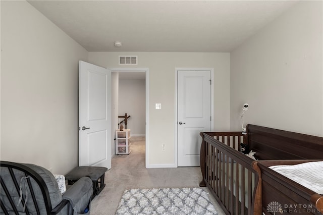 bedroom with light carpet