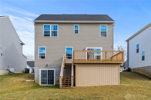 back of property featuring a yard and a deck