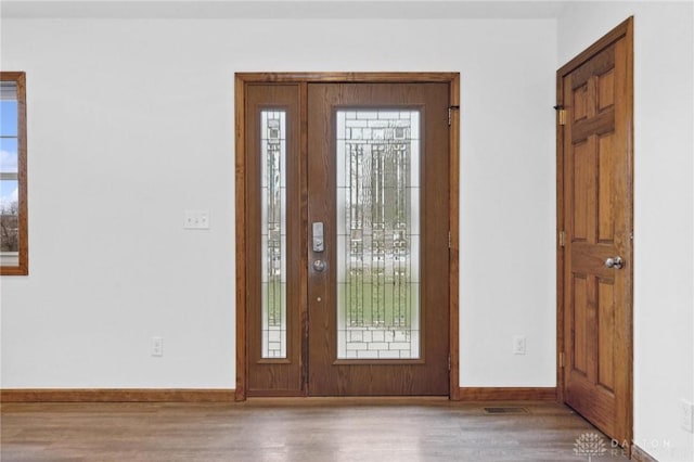 foyer with hardwood / wood-style flooring