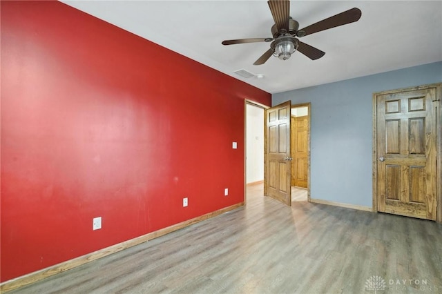 unfurnished bedroom with hardwood / wood-style flooring and ceiling fan