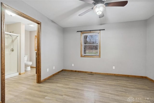 spare room featuring ceiling fan and light hardwood / wood-style flooring