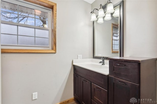 bathroom featuring vanity and an inviting chandelier