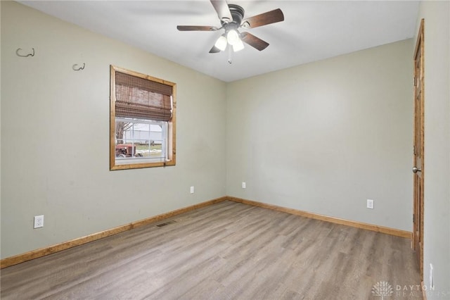 spare room featuring ceiling fan and light wood-type flooring