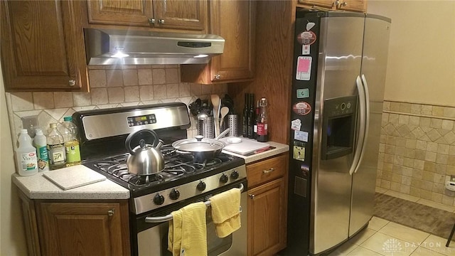 kitchen with light tile patterned floors and appliances with stainless steel finishes