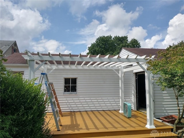 back of property featuring a pergola