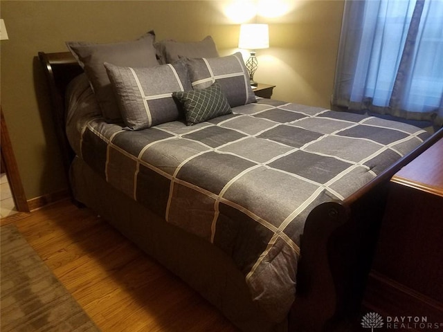 bedroom featuring wood-type flooring