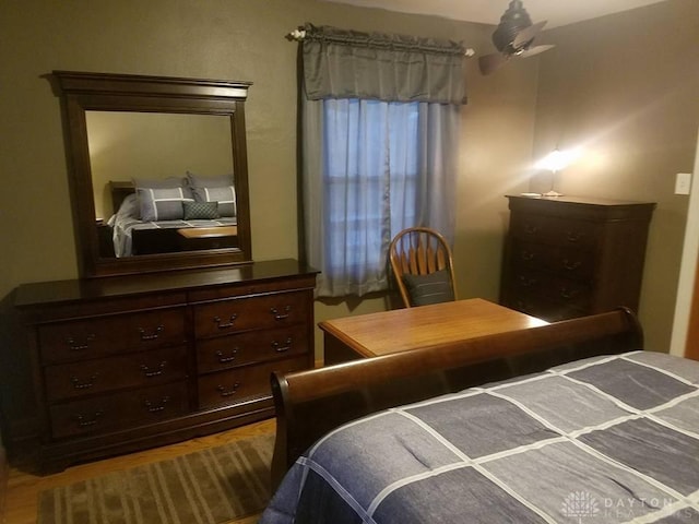 bedroom with wood-type flooring