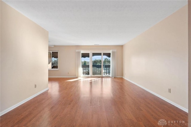 empty room featuring hardwood / wood-style floors