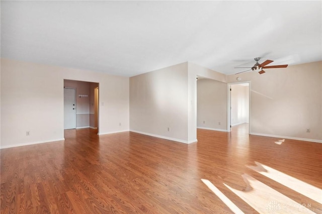 spare room featuring ceiling fan and hardwood / wood-style floors