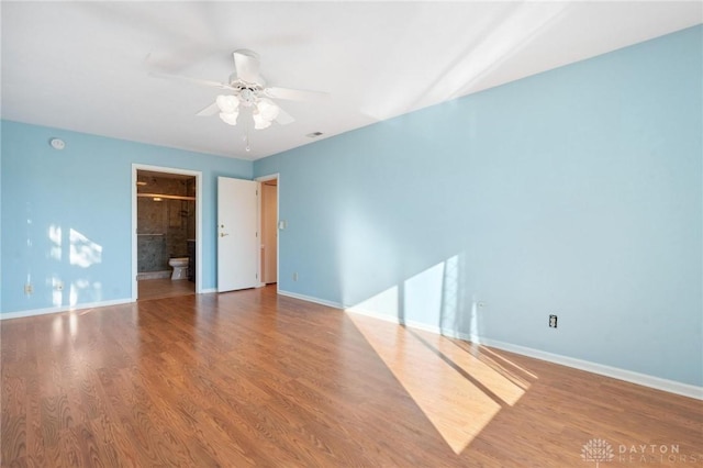 unfurnished room with hardwood / wood-style floors and ceiling fan