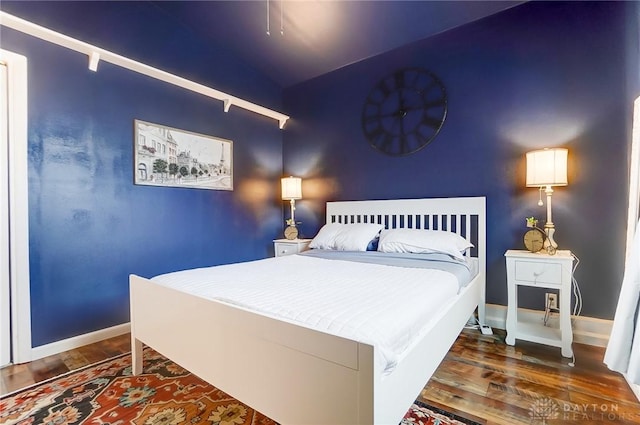 bedroom featuring dark wood-type flooring