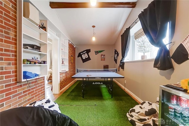 game room featuring brick wall