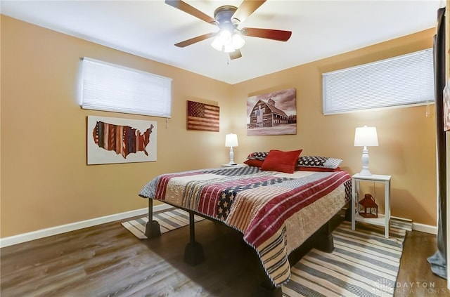 bedroom featuring ceiling fan and dark hardwood / wood-style flooring