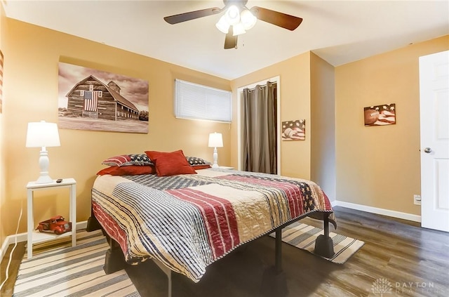 bedroom with hardwood / wood-style flooring and ceiling fan