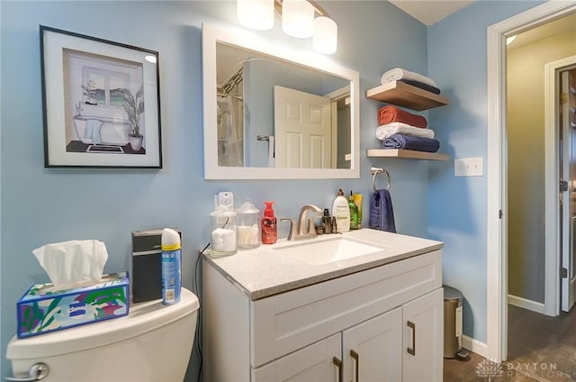 bathroom with vanity and toilet