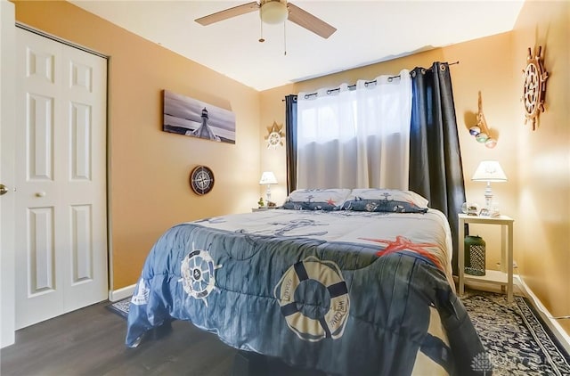 bedroom featuring ceiling fan and dark hardwood / wood-style flooring