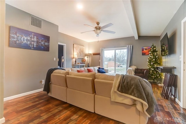 living room with ceiling fan, dark hardwood / wood-style floors, and beamed ceiling