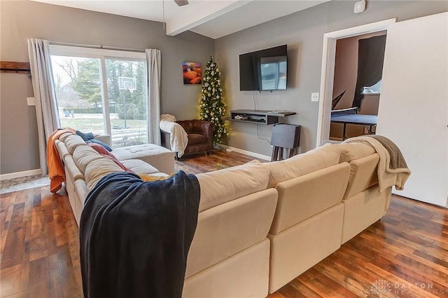 living room with ceiling fan, dark hardwood / wood-style flooring, and vaulted ceiling with beams