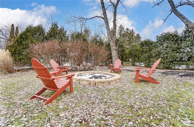 view of yard with an outdoor fire pit