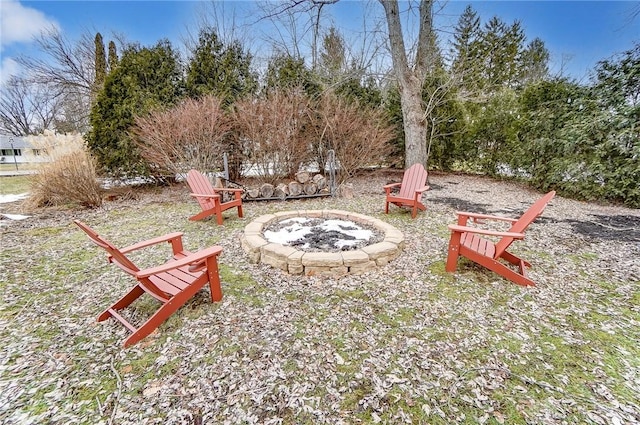 view of yard with a fire pit