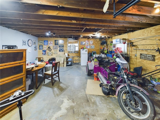 basement featuring white refrigerator