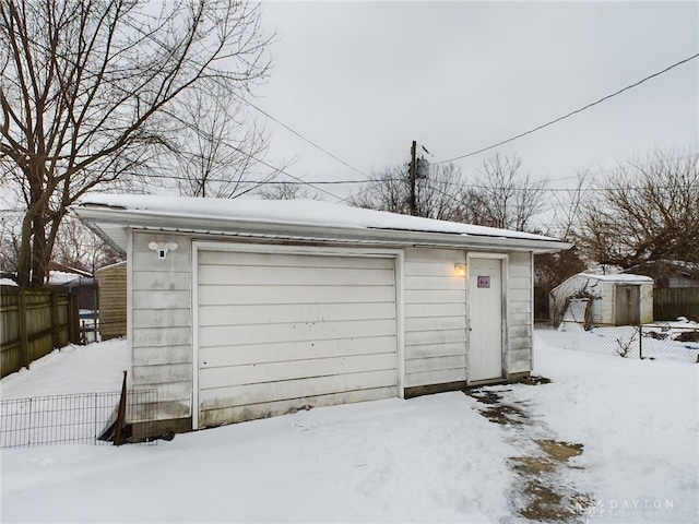 view of snow covered garage