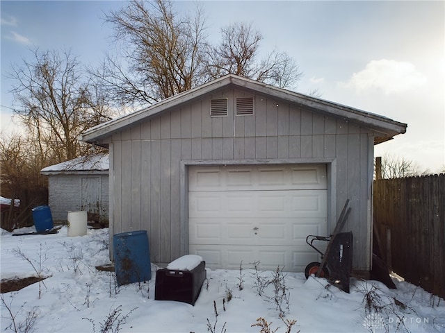 view of snow covered garage