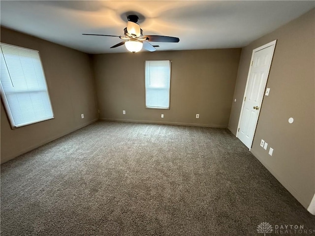 carpeted empty room with ceiling fan