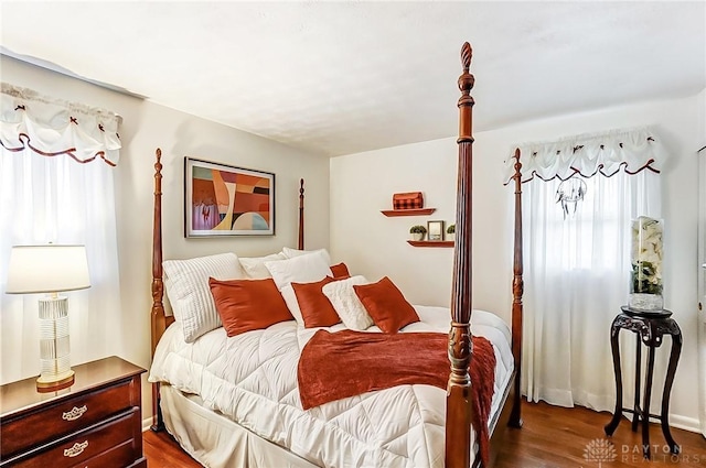 bedroom featuring dark wood-type flooring