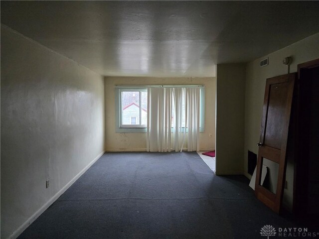 unfurnished living room featuring carpet floors