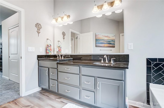 bathroom with vanity and hardwood / wood-style floors