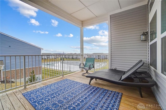 wooden deck with a water view