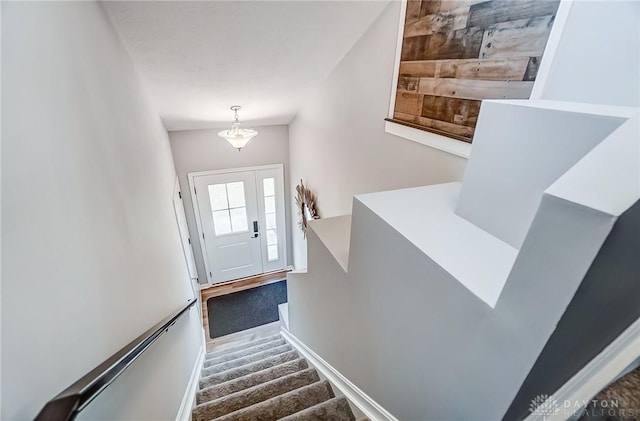 stairway featuring wood-type flooring