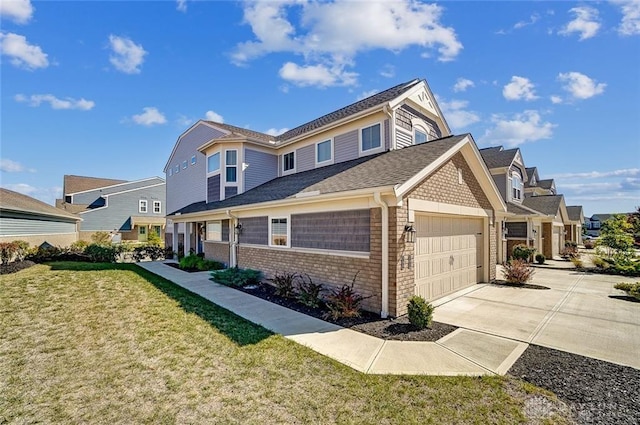 view of front of property with a garage and a front yard