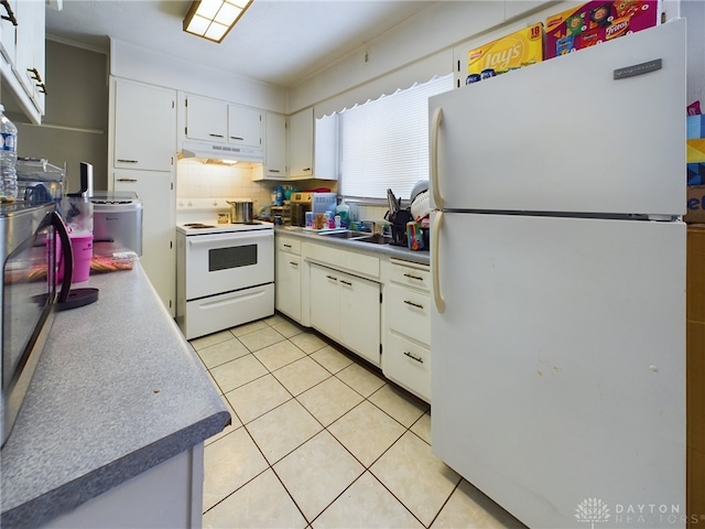 kitchen with sink, white appliances, white cabinets, light tile patterned flooring, and decorative backsplash