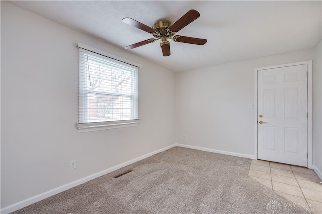 carpeted empty room with ceiling fan