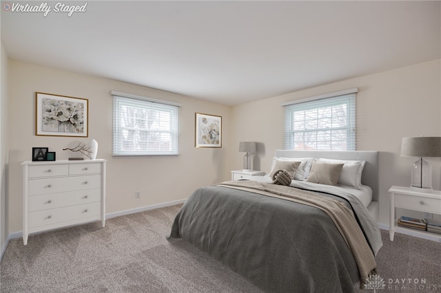 bedroom featuring light colored carpet