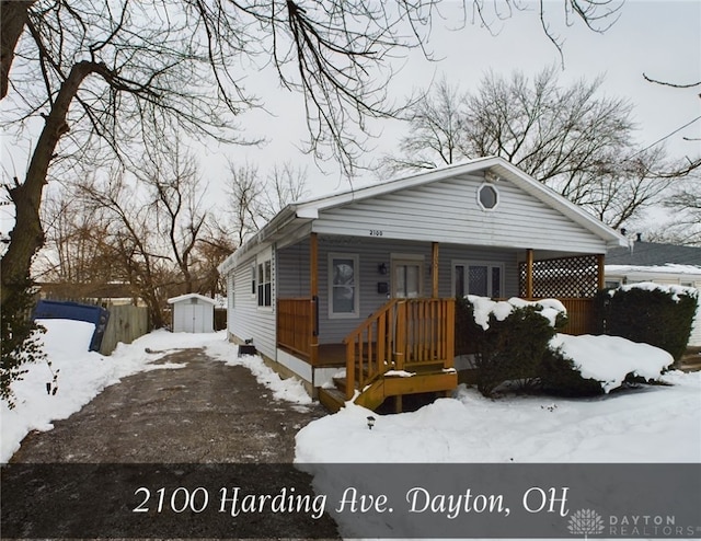 bungalow-style home featuring a shed