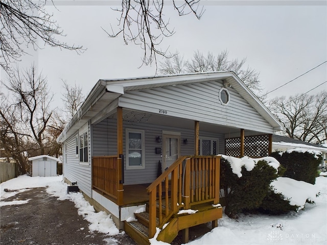 view of front of property with a storage unit