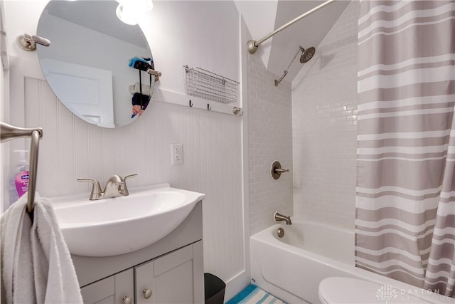 full bathroom featuring vanity, shower / tub combo, and toilet