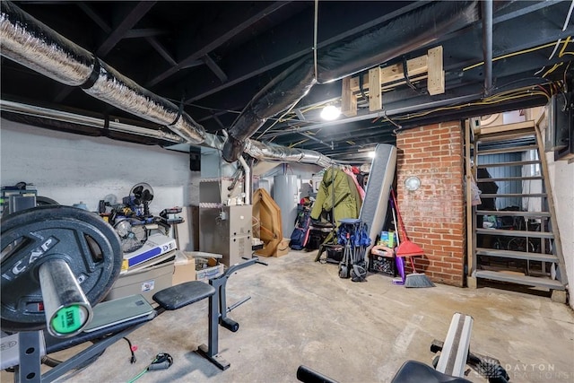 exercise area featuring water heater