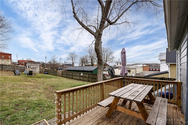 wooden deck with a yard