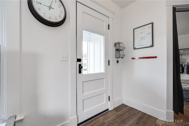 doorway featuring dark hardwood / wood-style floors