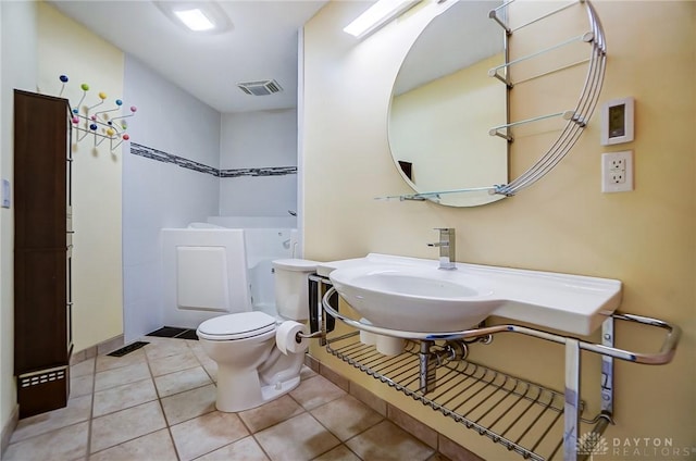 bathroom featuring tile patterned floors and toilet