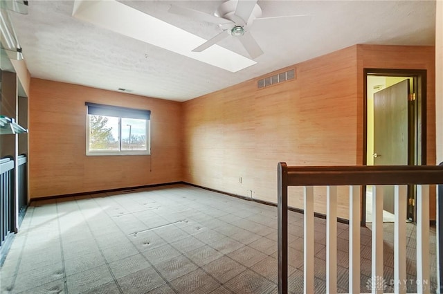 unfurnished room with ceiling fan