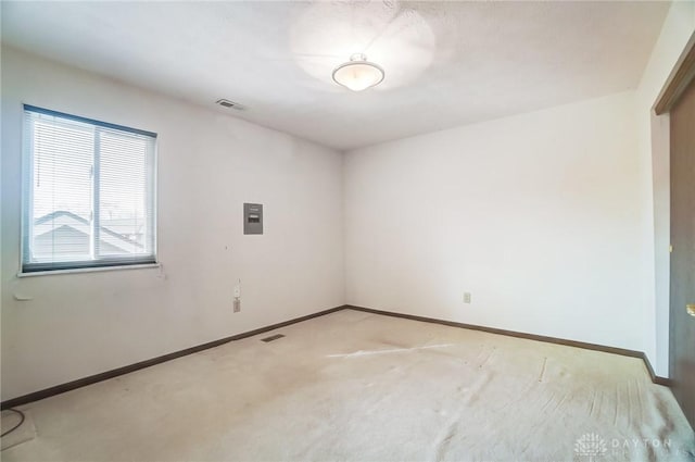 empty room featuring light colored carpet