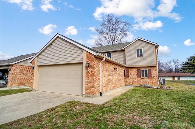 view of front of property featuring a garage and a front lawn