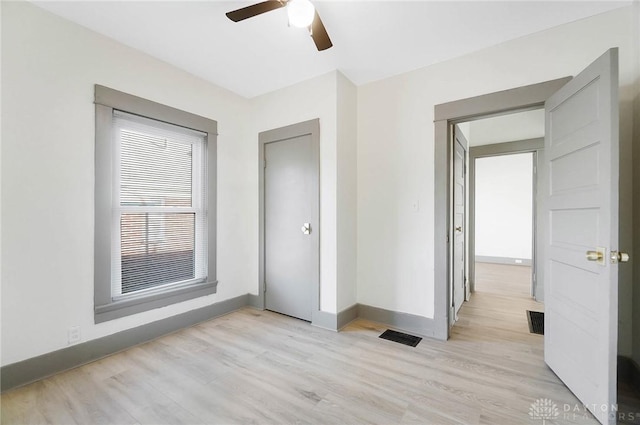 interior space with ceiling fan and light wood-type flooring