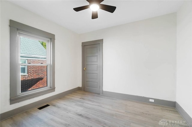 unfurnished room with light hardwood / wood-style flooring