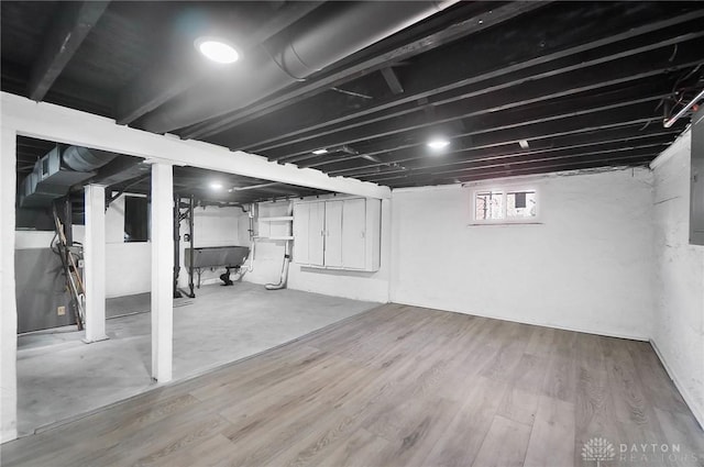 basement featuring hardwood / wood-style flooring